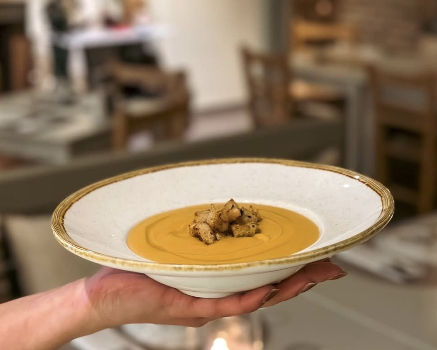 A bowl of fava carried through the SABOR dining room